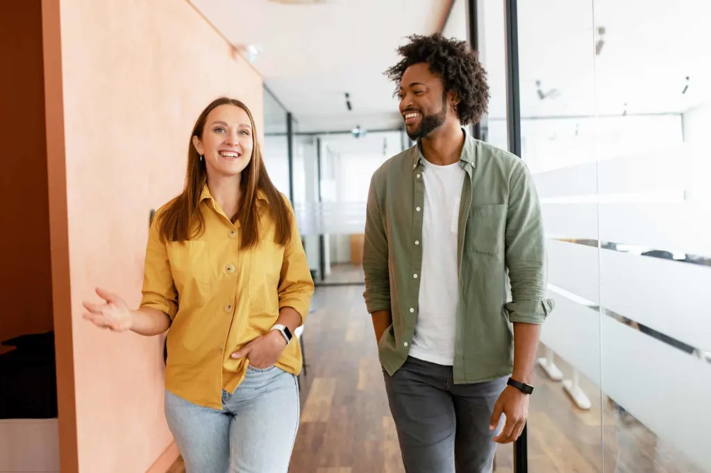 two colleagues engaged in small talk